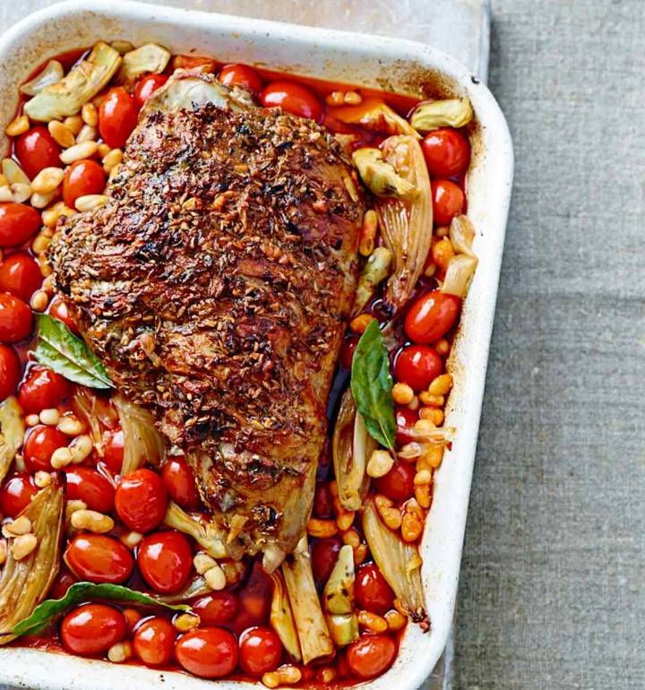 Slow-cooked spiced leg of lamb with artichokes, tomatoes and beans