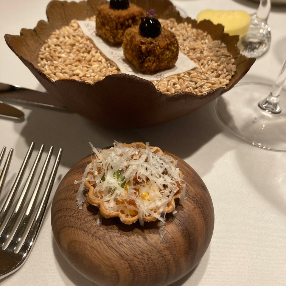 Canapes presented in stylish wooden dishes
